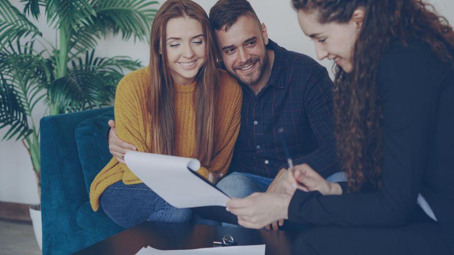 Couple meeting with a financial advisor in an office