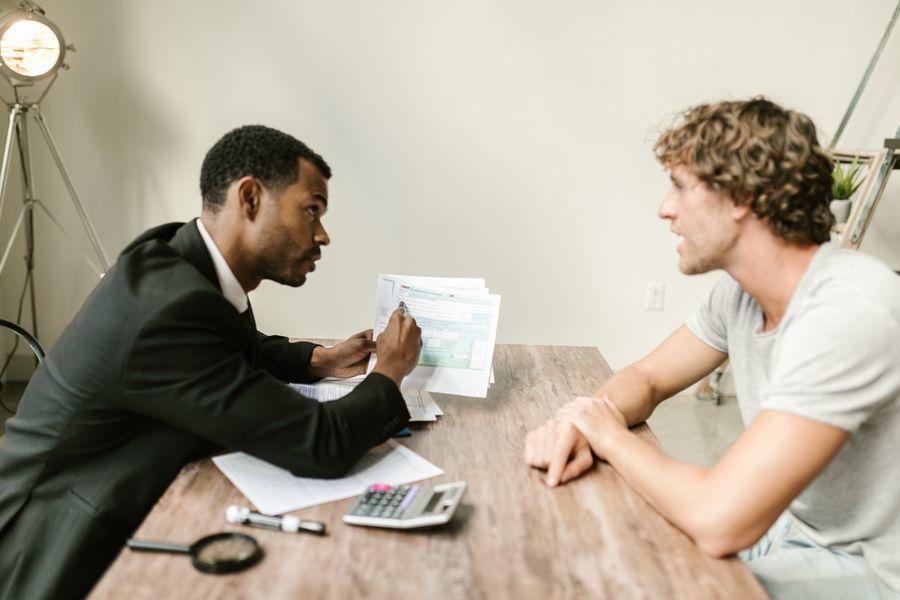 Bank professional reviewing financial documents with a customer