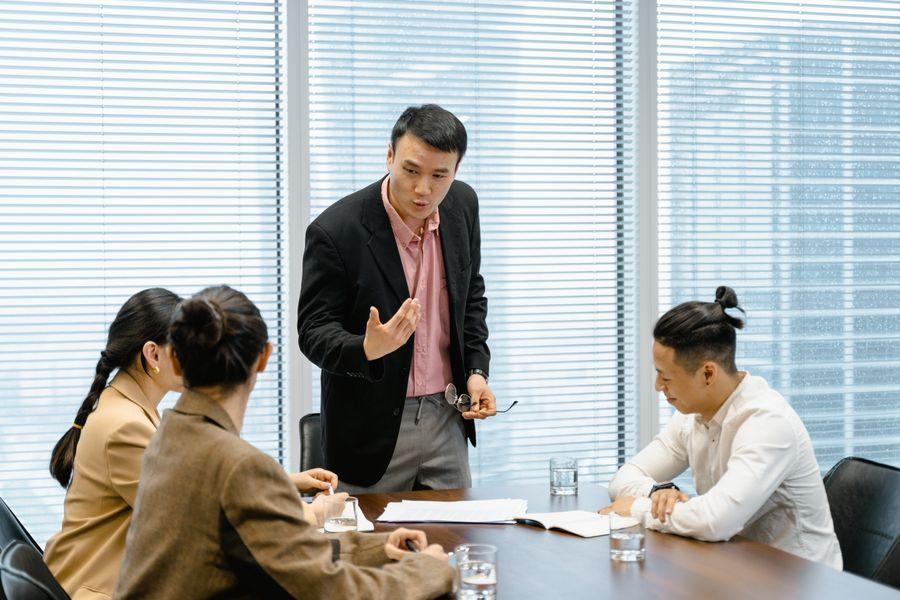 Employer leadership team discussing employee support