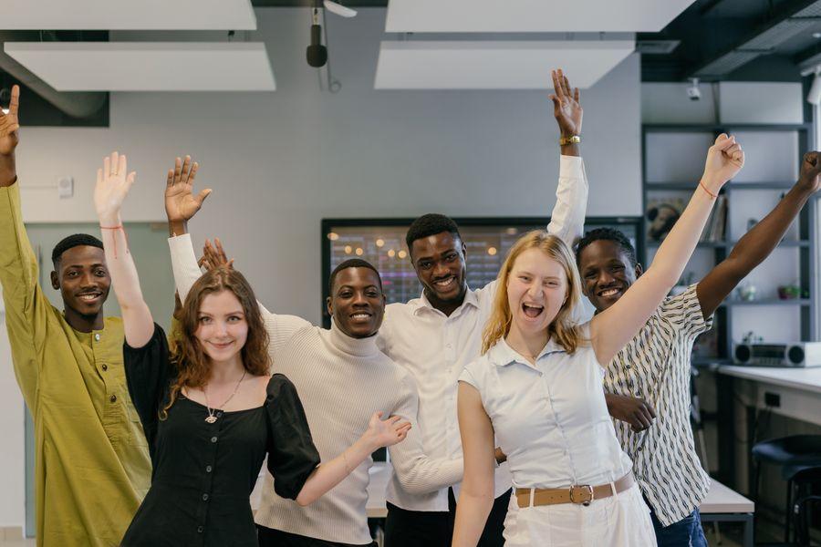 Employees celebrating progress together in the office