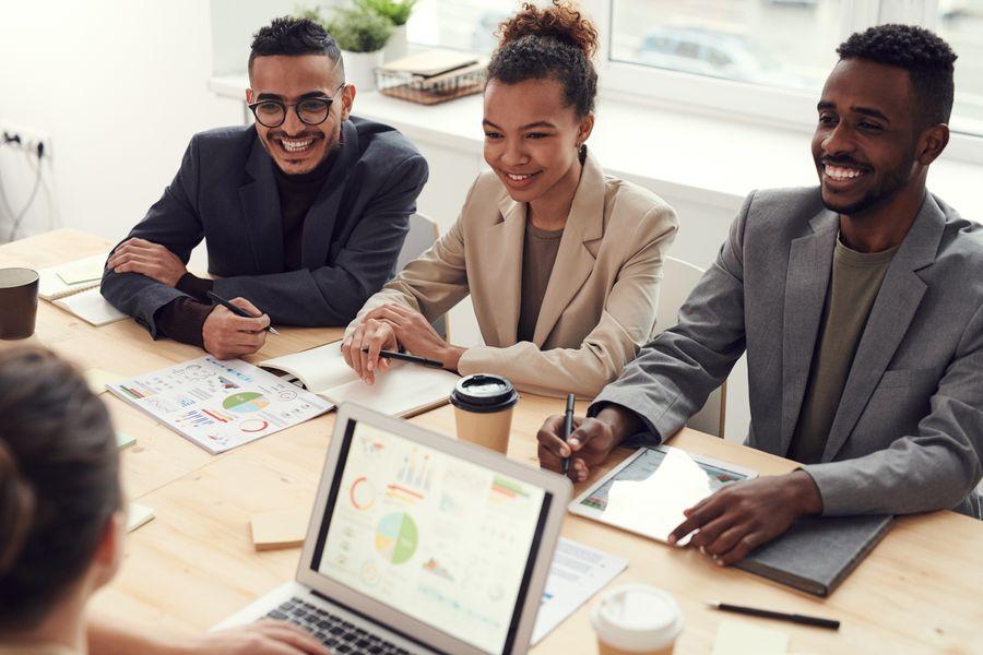 Employees collaborating in a modern workplace meeting